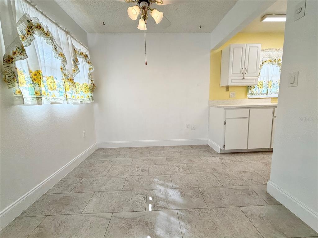 11817 Bayonet Lane New Port Richey, FL 34654 - Photo 4 of 32 a view of storage and utility room with a window