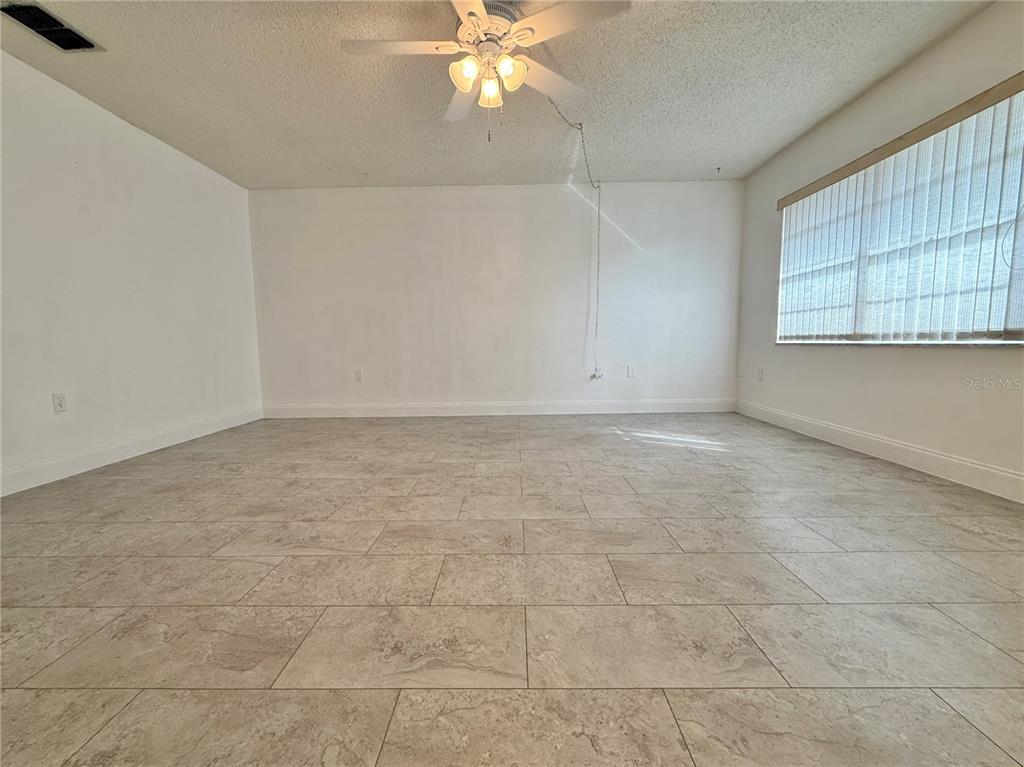 11817 Bayonet Lane New Port Richey, FL 34654 - Photo 5 of 32 a view of an empty room with a window