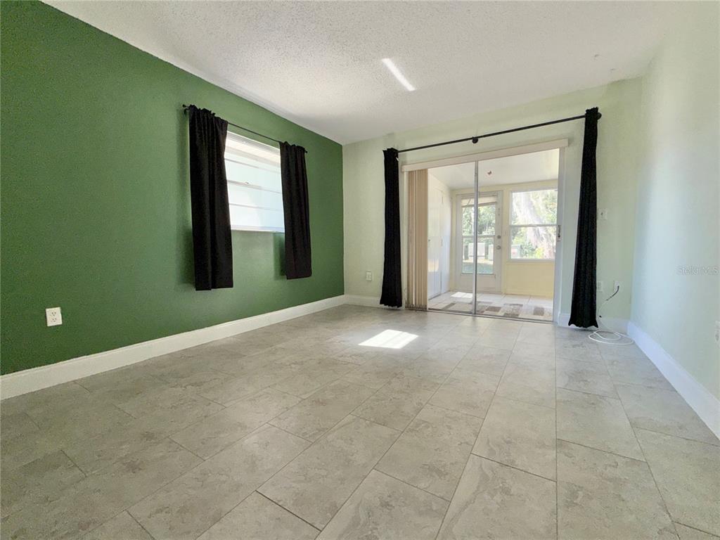 11817 Bayonet Lane New Port Richey, FL 34654 - Photo 7 of 32 a view of an empty room with a window