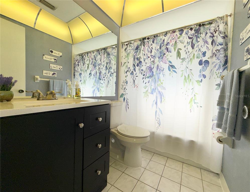 11817 Bayonet Lane New Port Richey, FL 34654 - Photo 7 of 32 a bathroom with a sink and a mirror