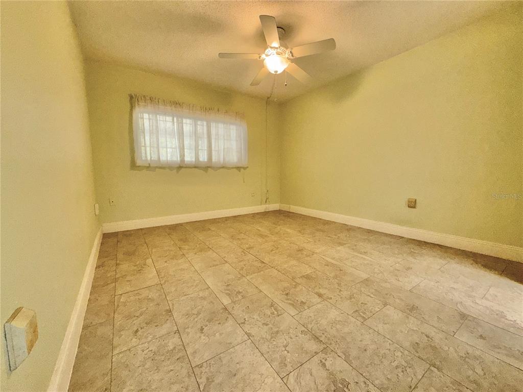 11817 Bayonet Lane New Port Richey, FL 34654 - Photo 9 of 32 a view of an empty room with a window