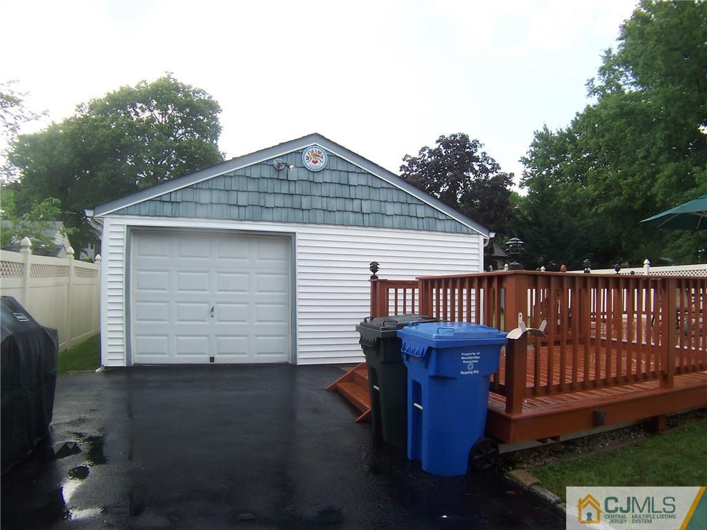 46 West Cliff Road Colonia, NJ 07067 - Photo 22 of 25 a front view of a house with a garden
