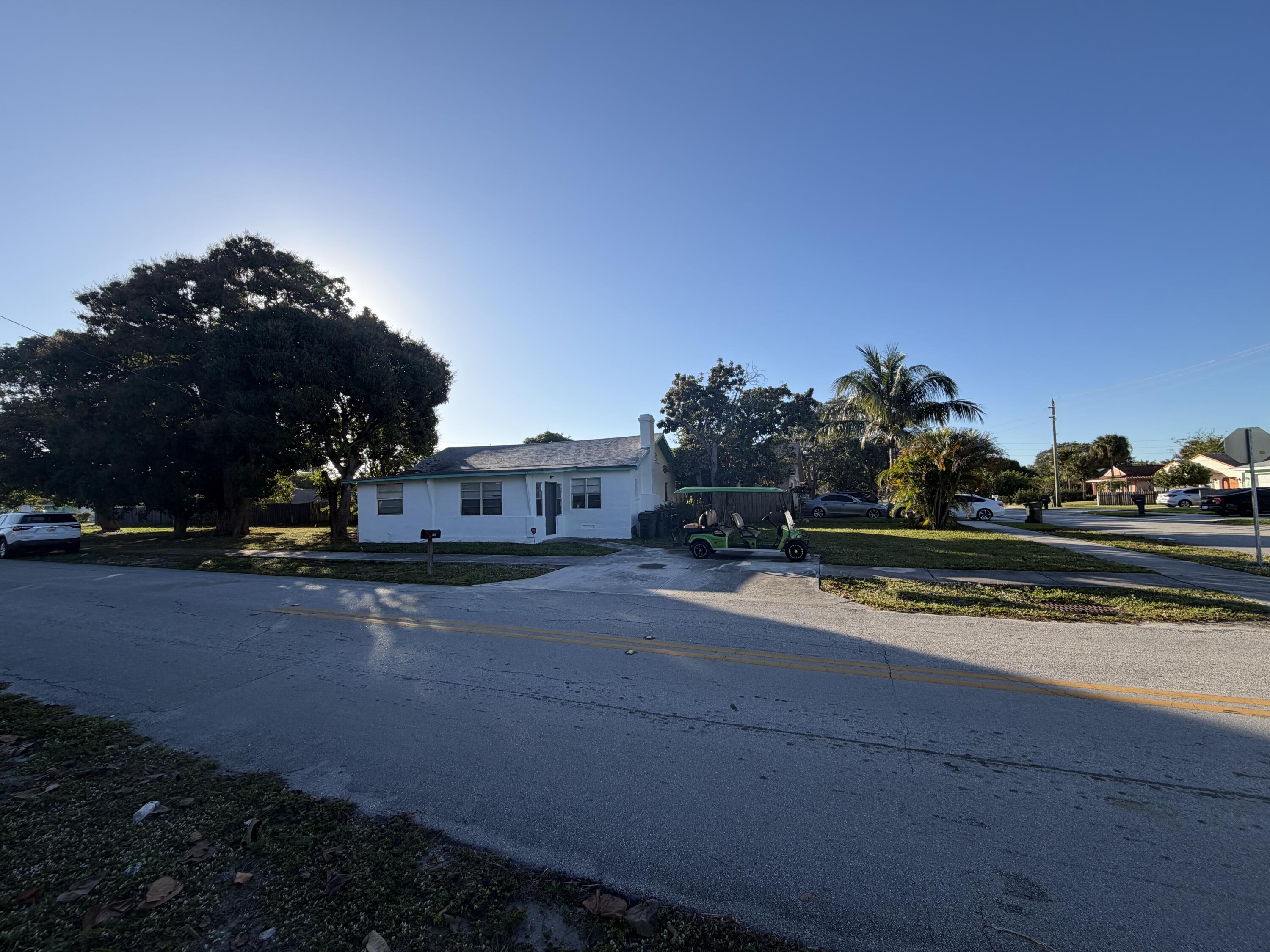 520 Northwest 3rd Street Delray Beach, FL 33444 - Photo 2 of 7 a view of a street with houses on both side