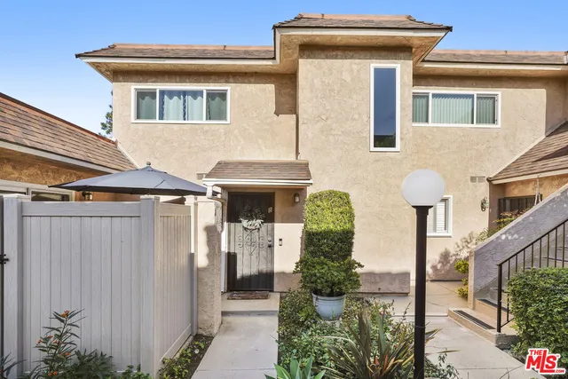 a front view of a house with yard