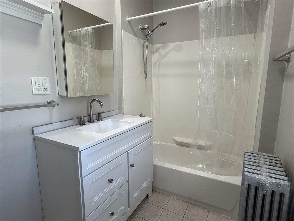 6 Channing Street, Unit 1 Newton, MA 02458 - Photo 11 of 16 a bathroom with a sink toilet and shower