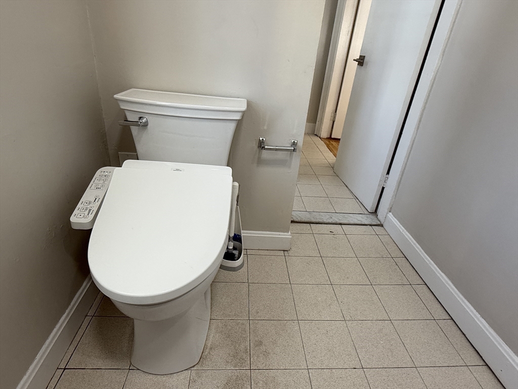 6 Channing Street, Unit 1 Newton, MA 02458 - Photo 13 of 16 a bathroom with a toilet and a rug