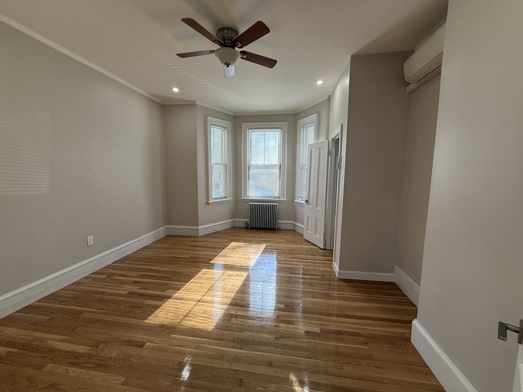6 Channing Street, Unit 1 Newton, MA 02458 - Photo 15 of 16 a view of a room with wooden floor and window