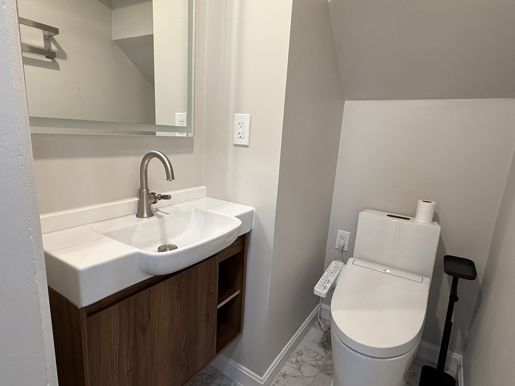 6 Channing Street, Unit 1 Newton, MA 02458 - Photo 5 of 16 a bathroom with a sink and a toilet