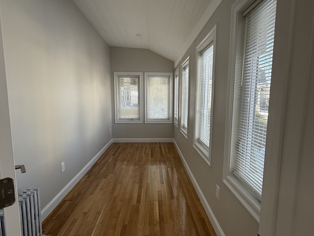 6 Channing Street, Unit 1 Newton, MA 02458 - Photo 6 of 16 a view of a room with wooden floor and staircase