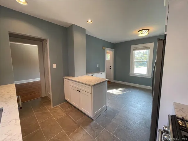 a bathroom with a sink vanity and a mirror