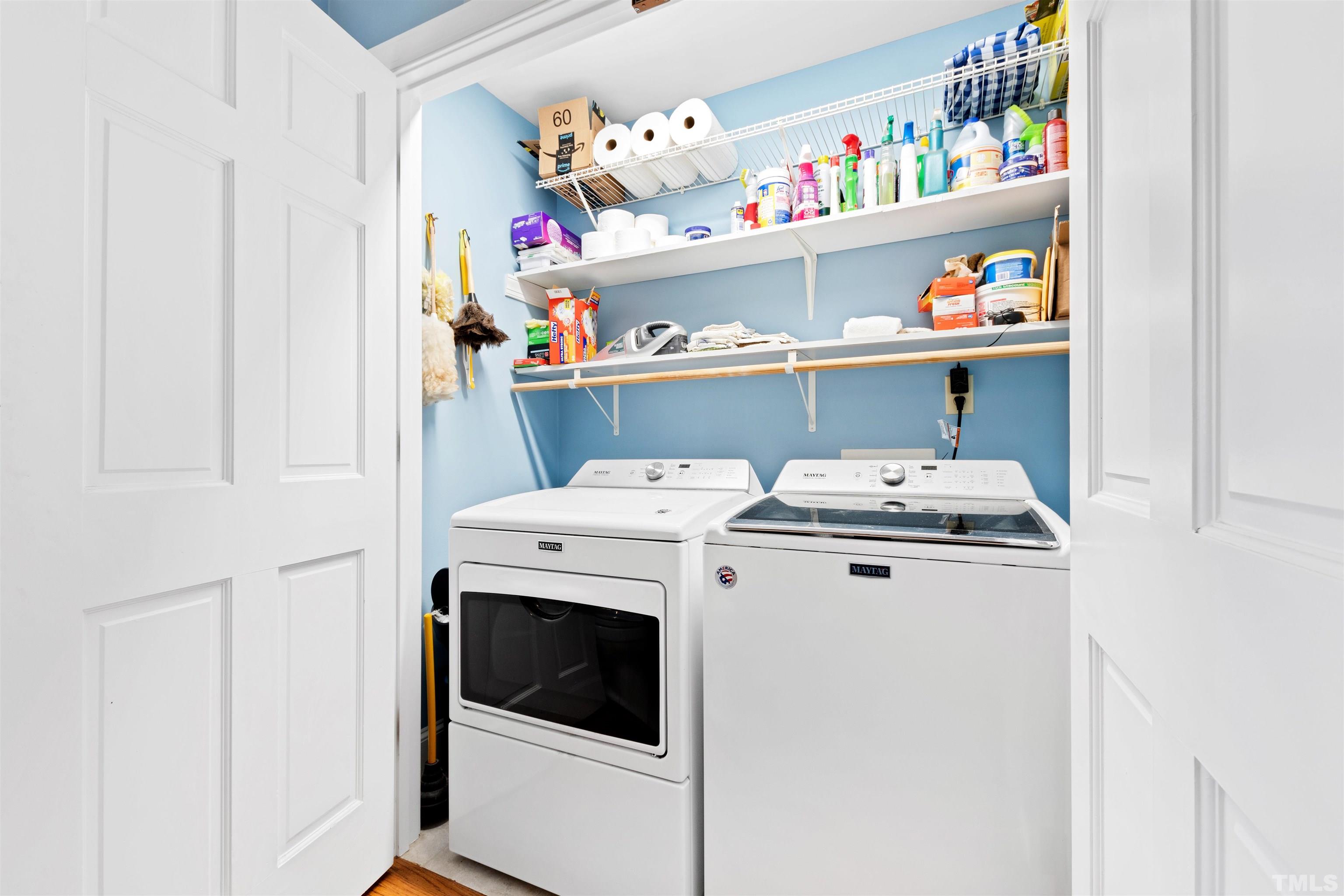 9429 Barton Creek Road Raleigh, NC 27615 - Photo 18 of 78 a utility room with dryer washer and shoe rack