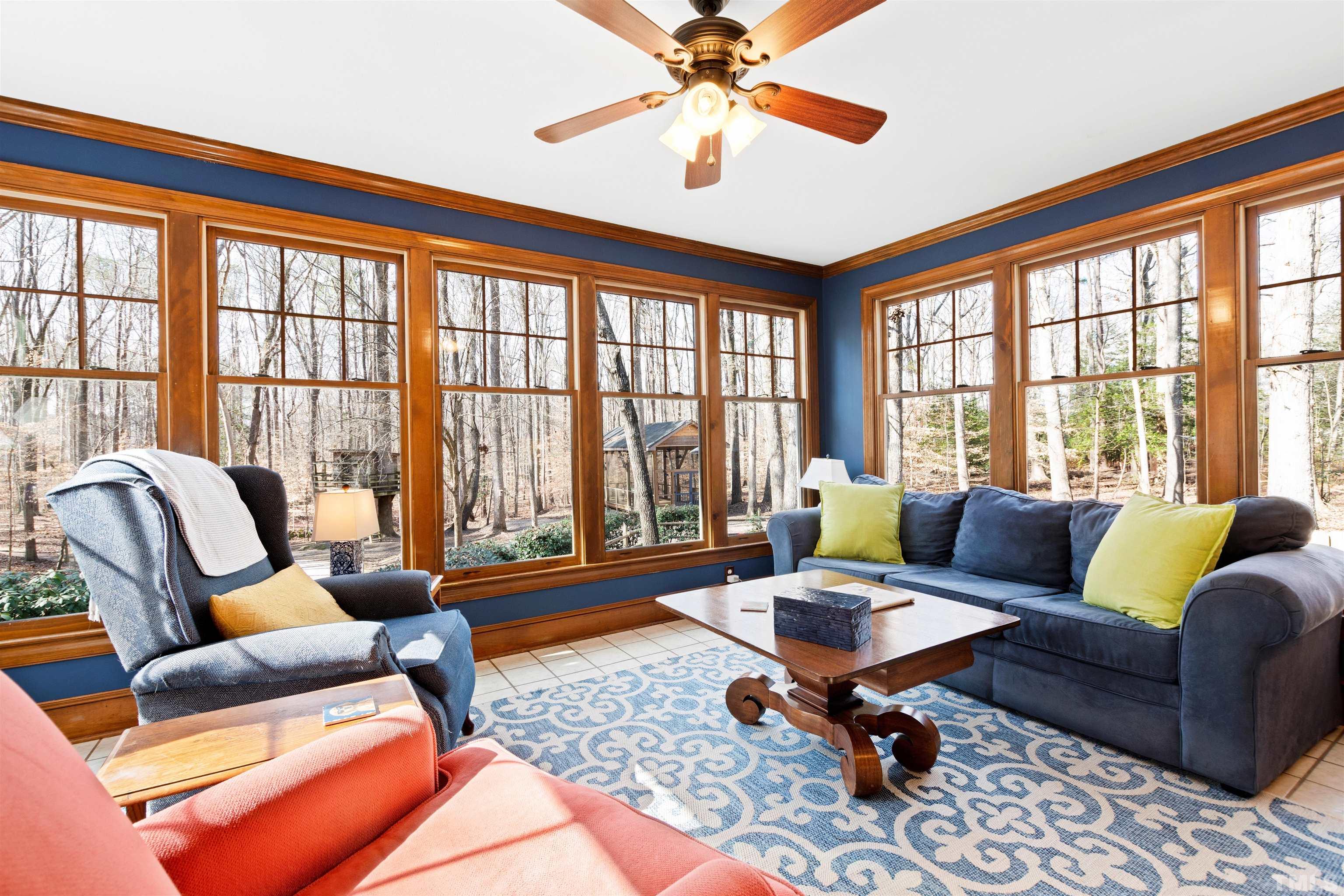 9429 Barton Creek Road Raleigh, NC 27615 - Photo 24 of 78 a living room with furniture a table and a large window