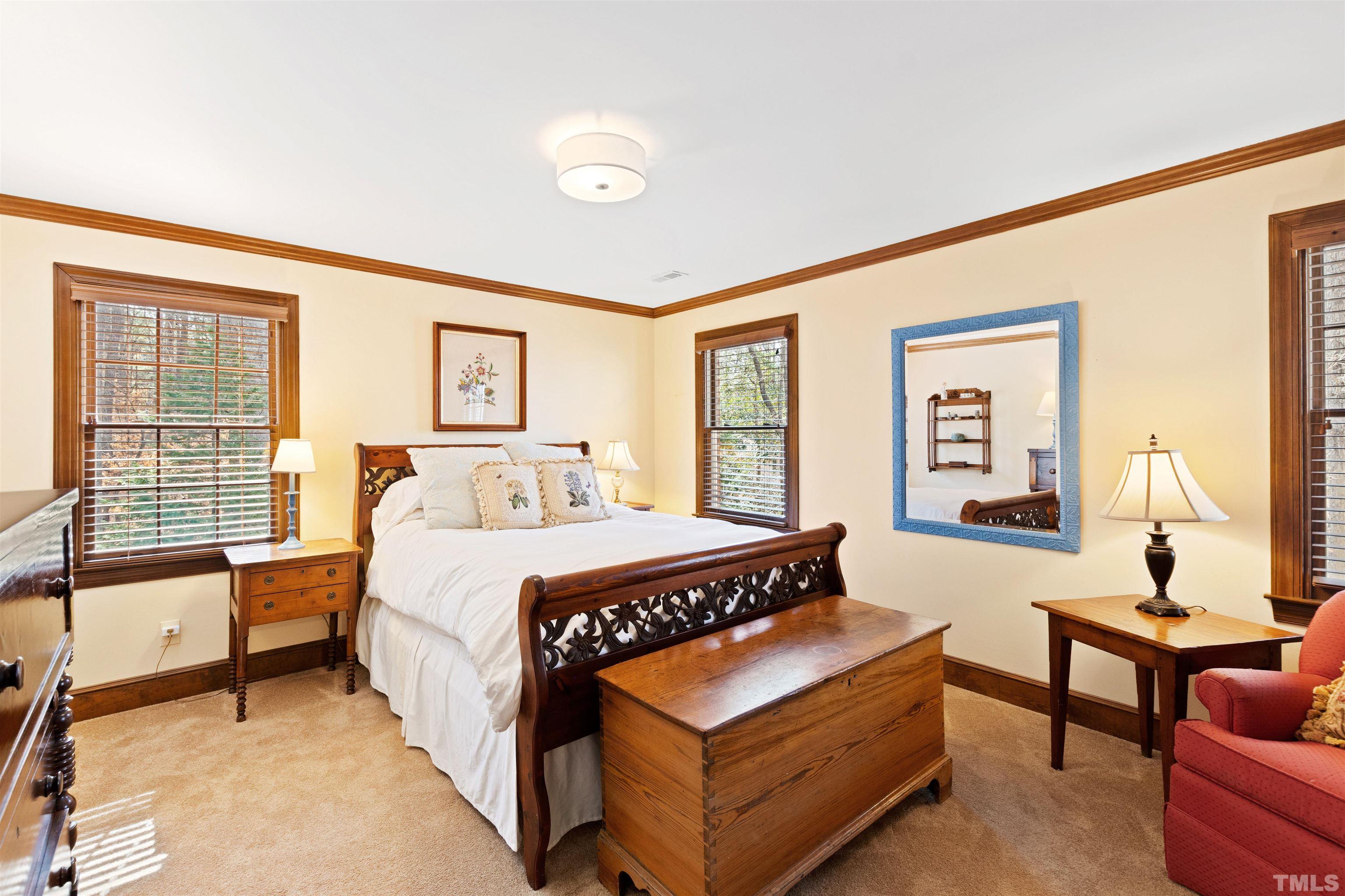 9429 Barton Creek Road Raleigh, NC 27615 - Photo 44 of 78 a bedroom with a bed and a couch
