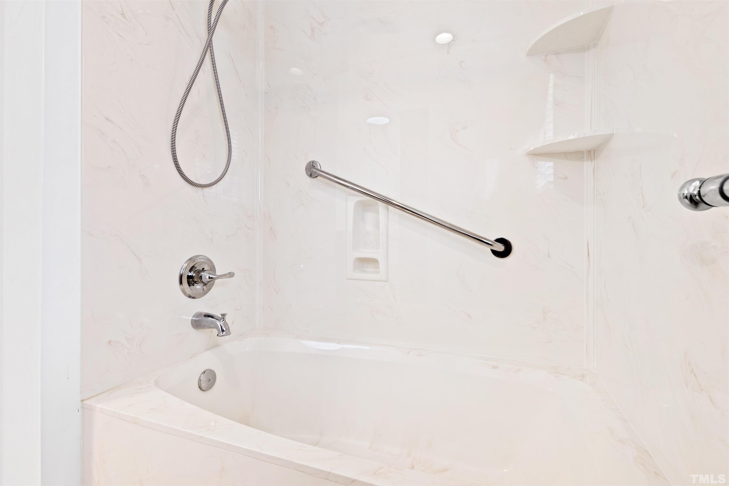 9429 Barton Creek Road Raleigh, NC 27615 - Photo 47 of 78 a bathroom with a bath tub with a shower