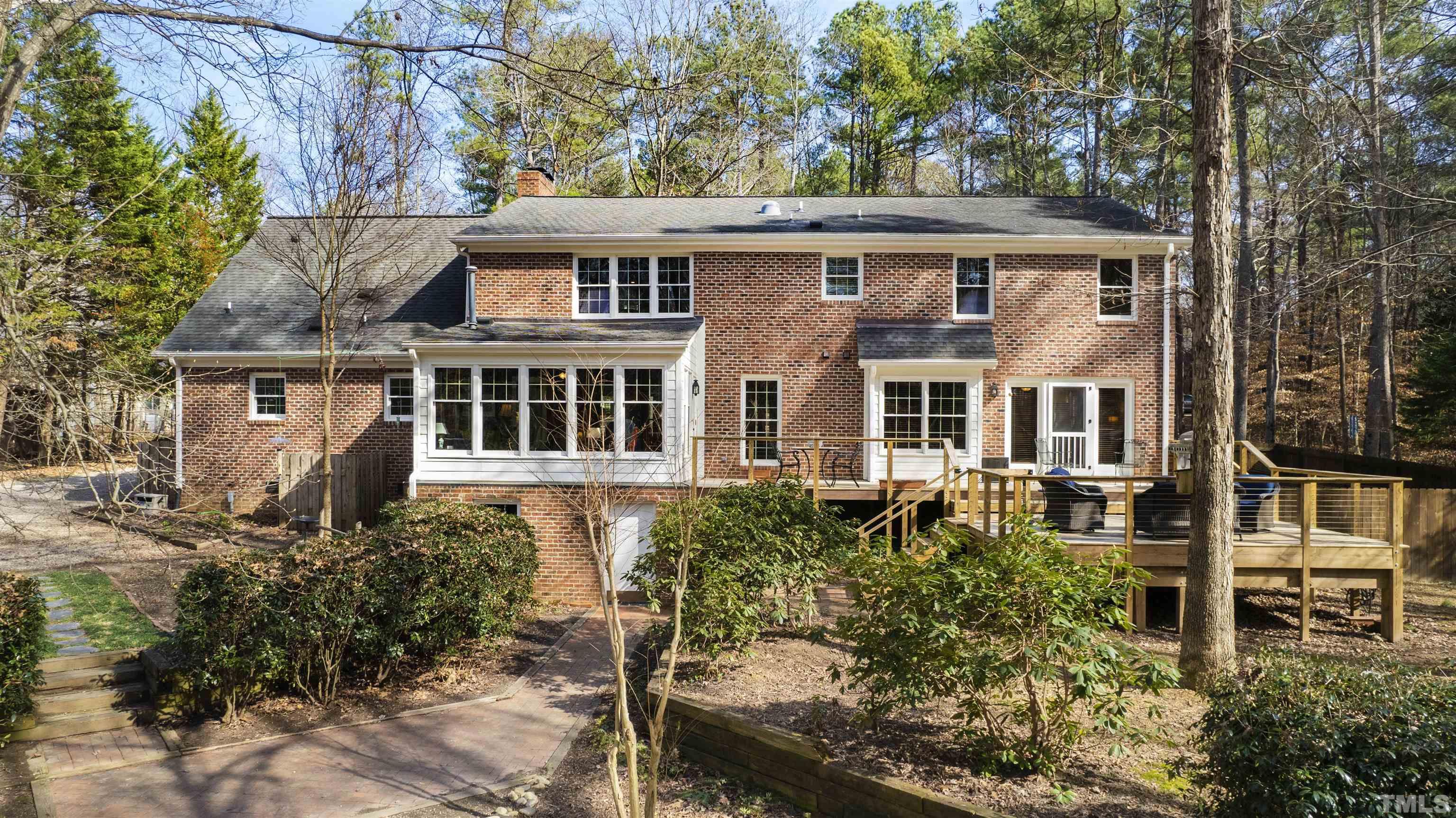 9429 Barton Creek Road Raleigh, NC 27615 - Photo 55 of 78 front view of a house with a bench