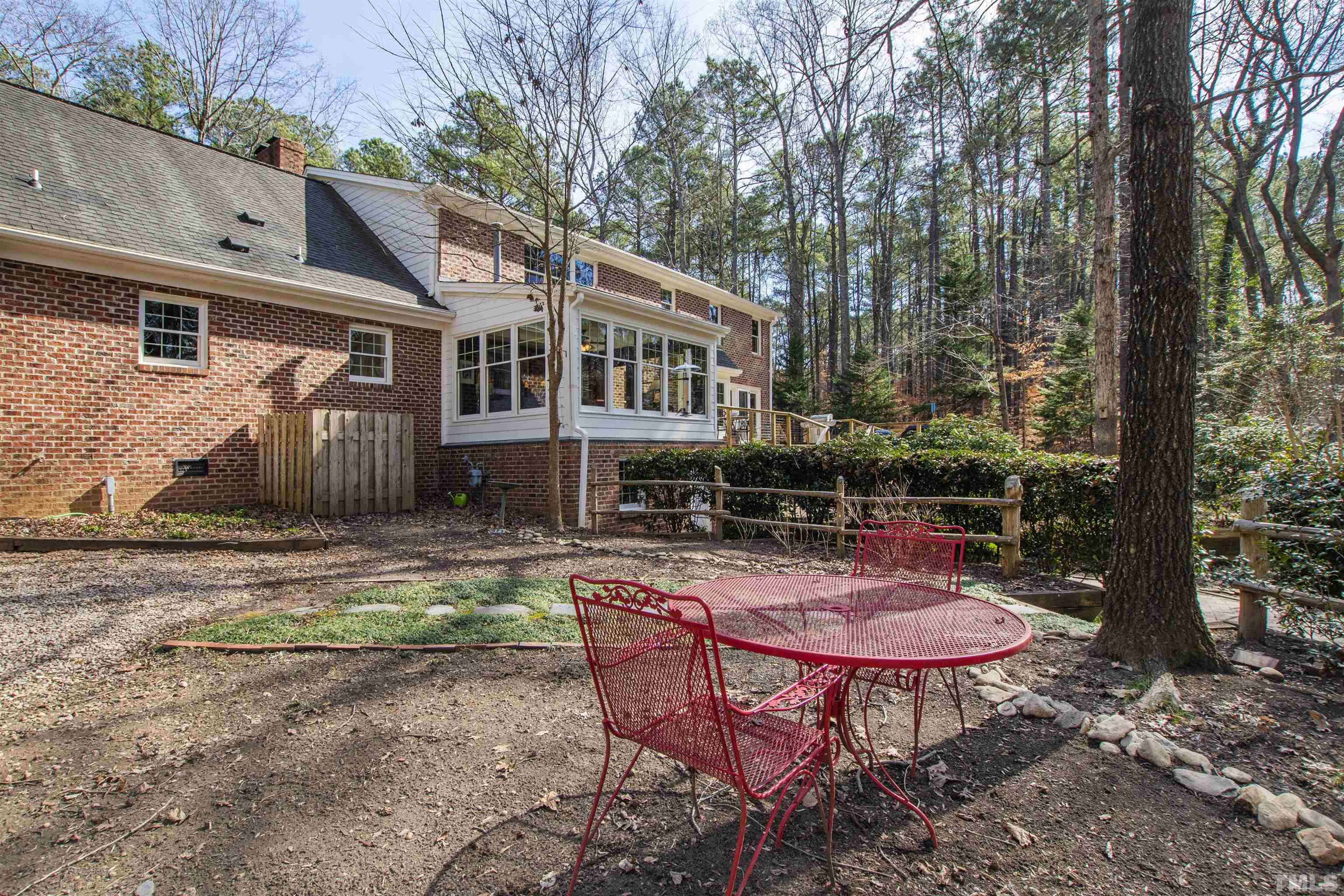 9429 Barton Creek Road Raleigh, NC 27615 - Photo 58 of 78 a backyard of a house with table and chairs