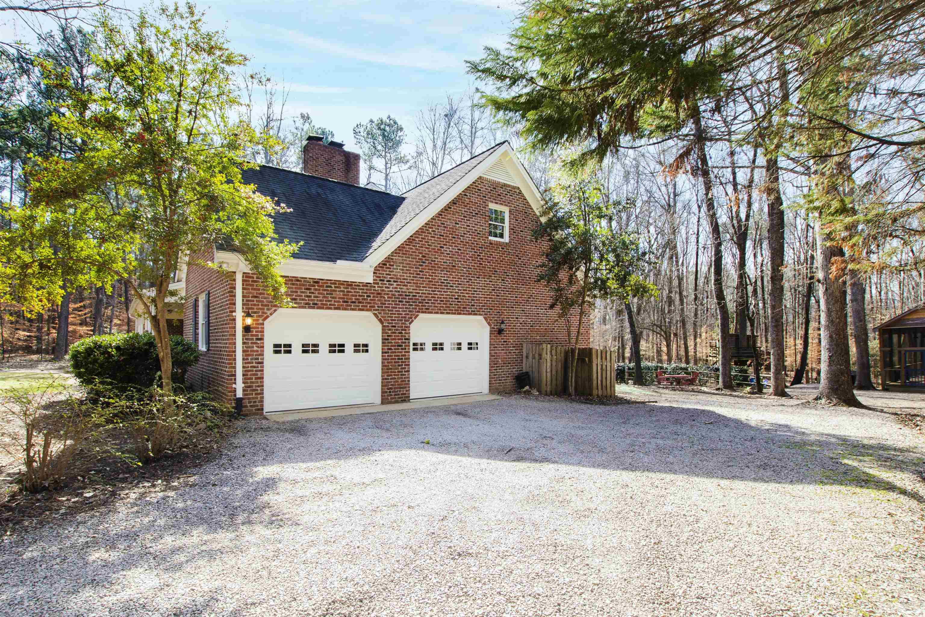9429 Barton Creek Road Raleigh, NC 27615 - Photo 71 of 78 a front view of a house with a yard and garage