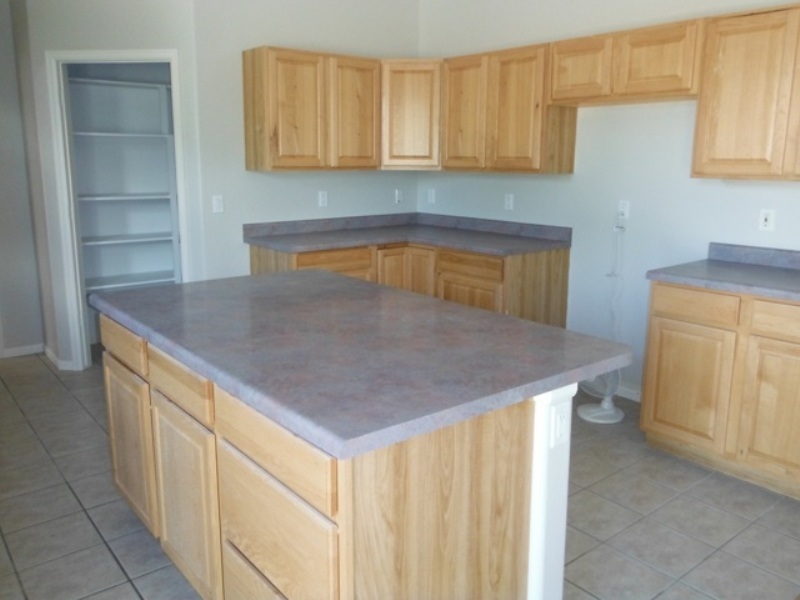 22056 Cliff View Road Delta, CO 81416 - Photo 8 of 15 a kitchen with a sink a cabinets and wooden floor