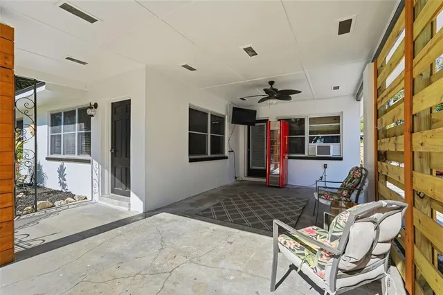 a living room with fireplace furniture and a window