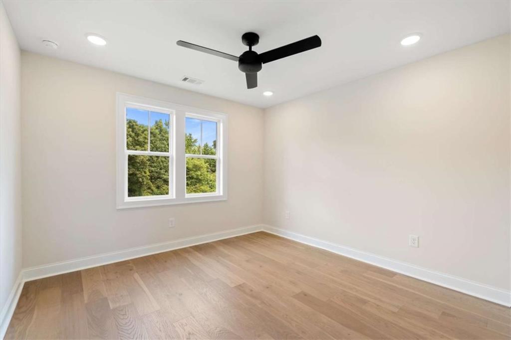 591 Welcome Road Roopville, GA 30170 - Photo 43 of 60 an empty room with wooden floor and windows