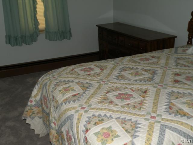 343 Broad Street Emmaus, PA 18049 - Photo 8 of 16 a bed sitting in a bedroom next to a window