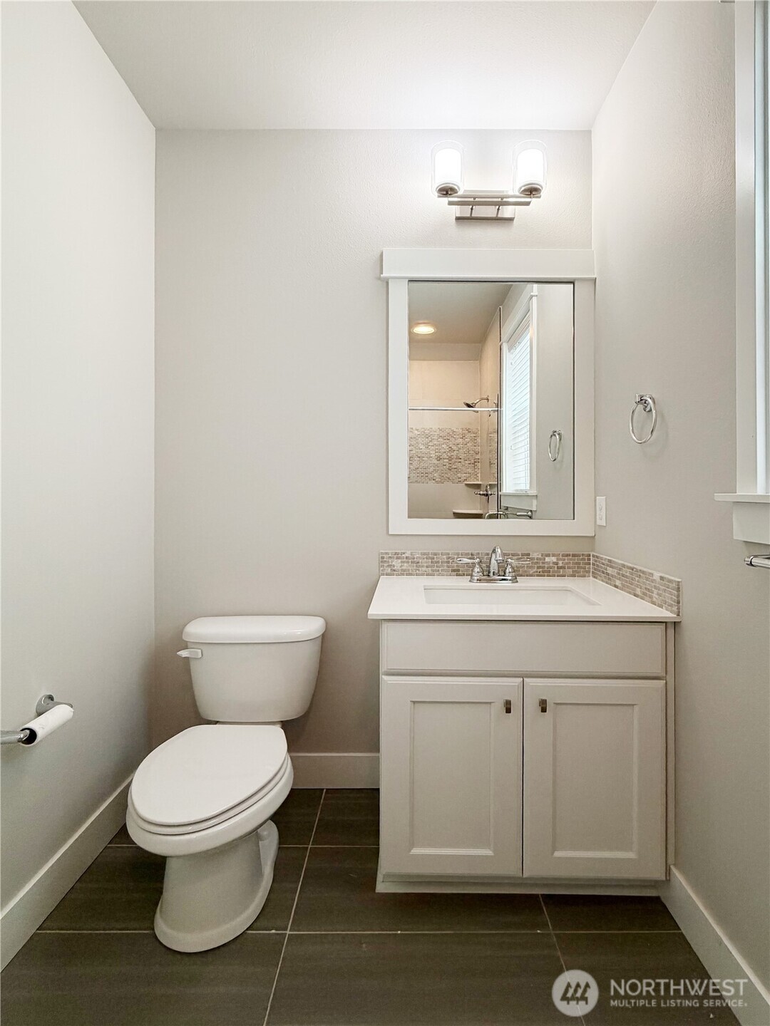 16529 White Mountain Road Southeast Monroe, WA 98272 - Photo 16 of 34 a bathroom with a toilet sink and mirror