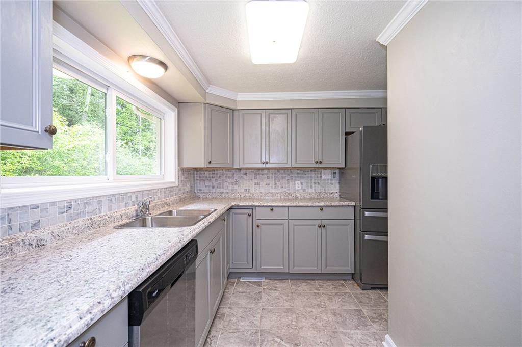 321 Logan Road Imperial, PA 15126 - Photo 3 of 24 Stylish kitchen with plenty of cabinetry.