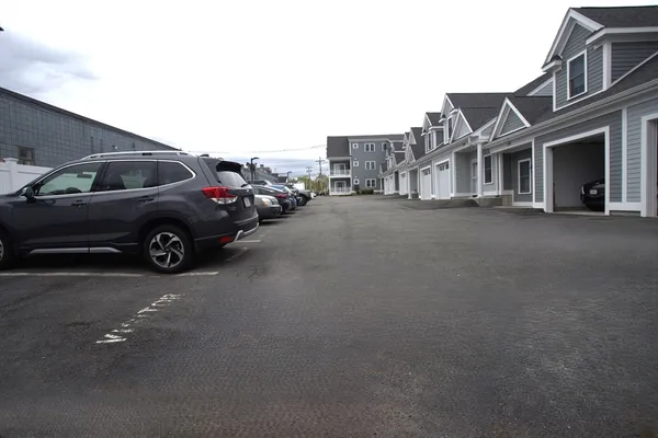 a view of a car parked in front of a house