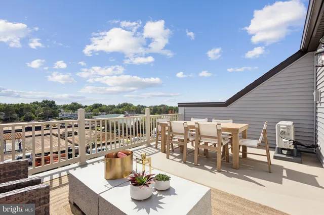 a terrace with outdoor seating and city view