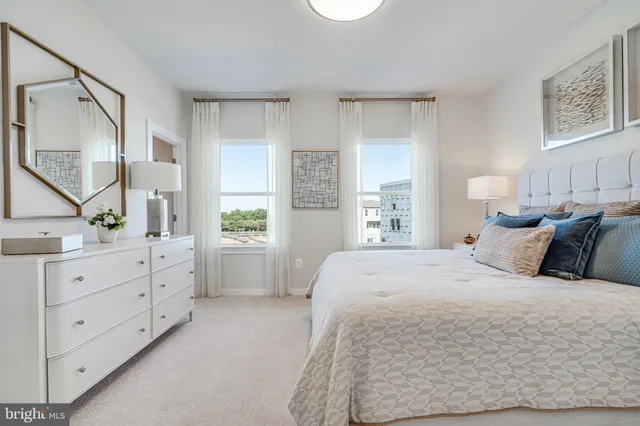 a spacious bedroom with a large bed and a window