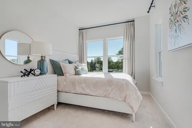 a bedroom with a bed and a view of bathroom