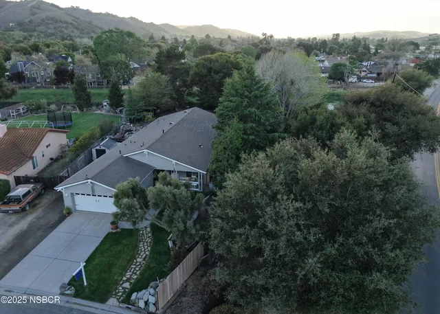 an aerial view of a house with mountain view