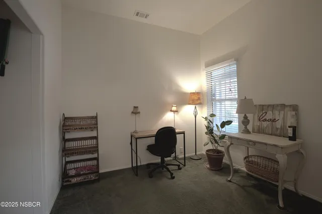 a view of a livingroom with furniture