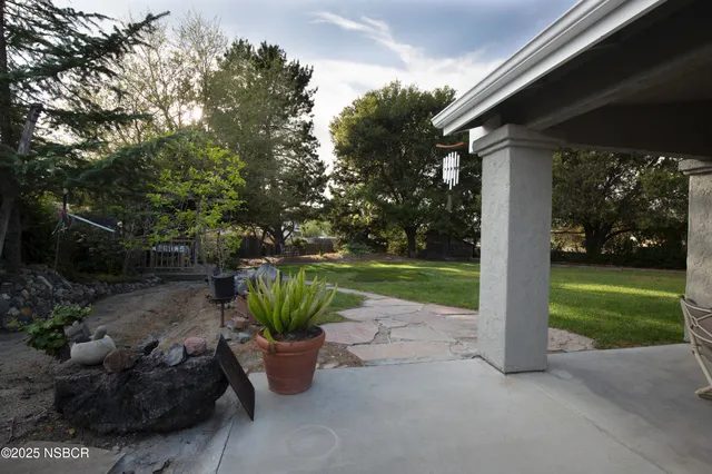 a view of a garden with patio