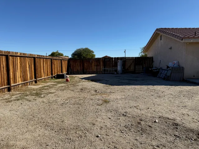 a view of a backyard of the house