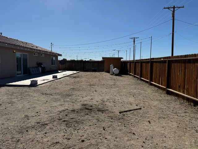 a view of a backyard of the house