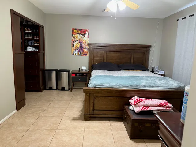a bedroom with a bed and a cabinets