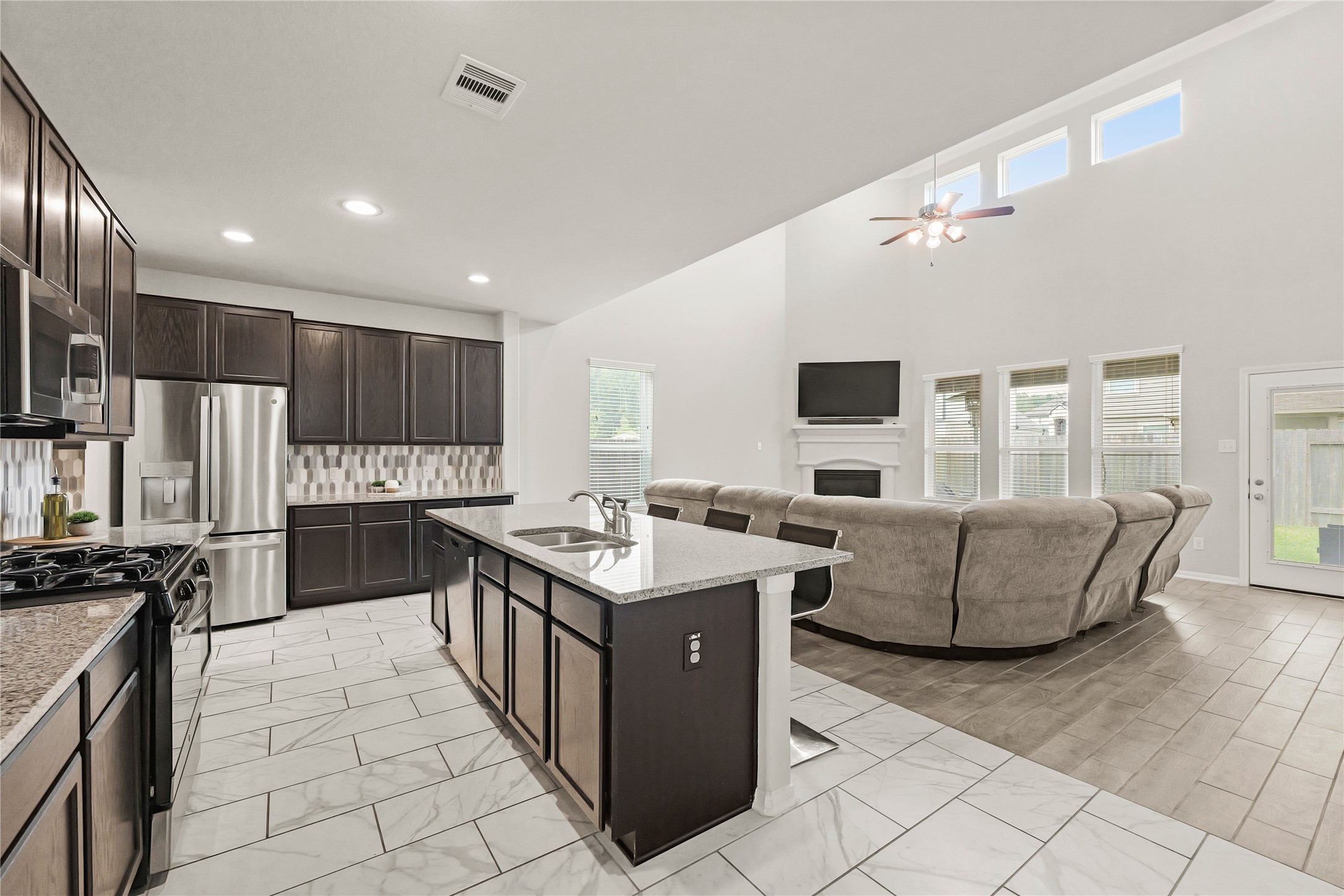 11107 Larkspur Dale Houston, TX 77044 - Photo 11 of 36 a kitchen with granite countertop a sink and counter top space