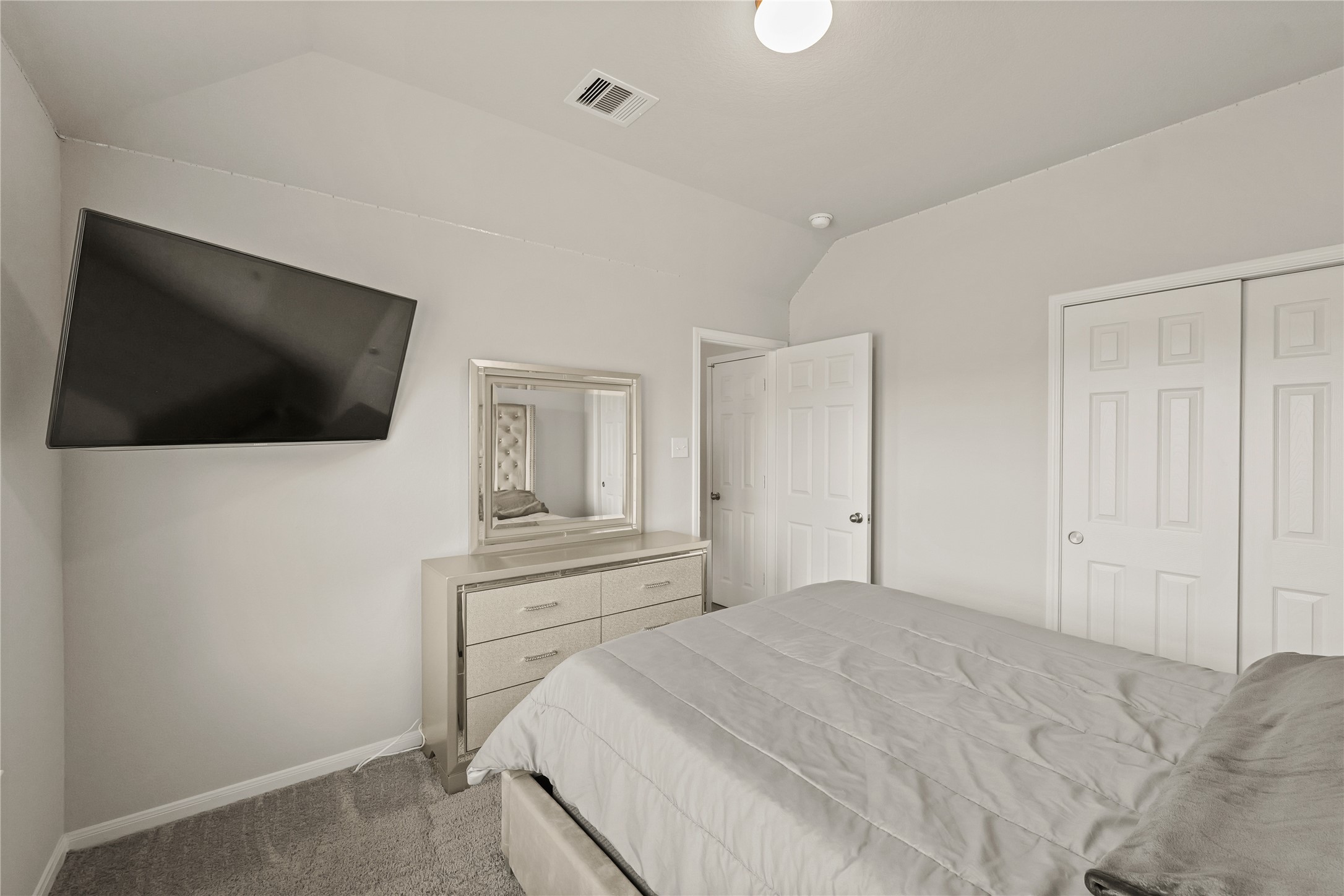 11107 Larkspur Dale Houston, TX 77044 - Photo 22 of 36 a bedroom with a bed and a flat screen tv
