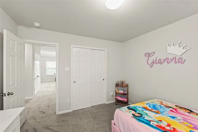 a bedroom with a bed and a cabinets