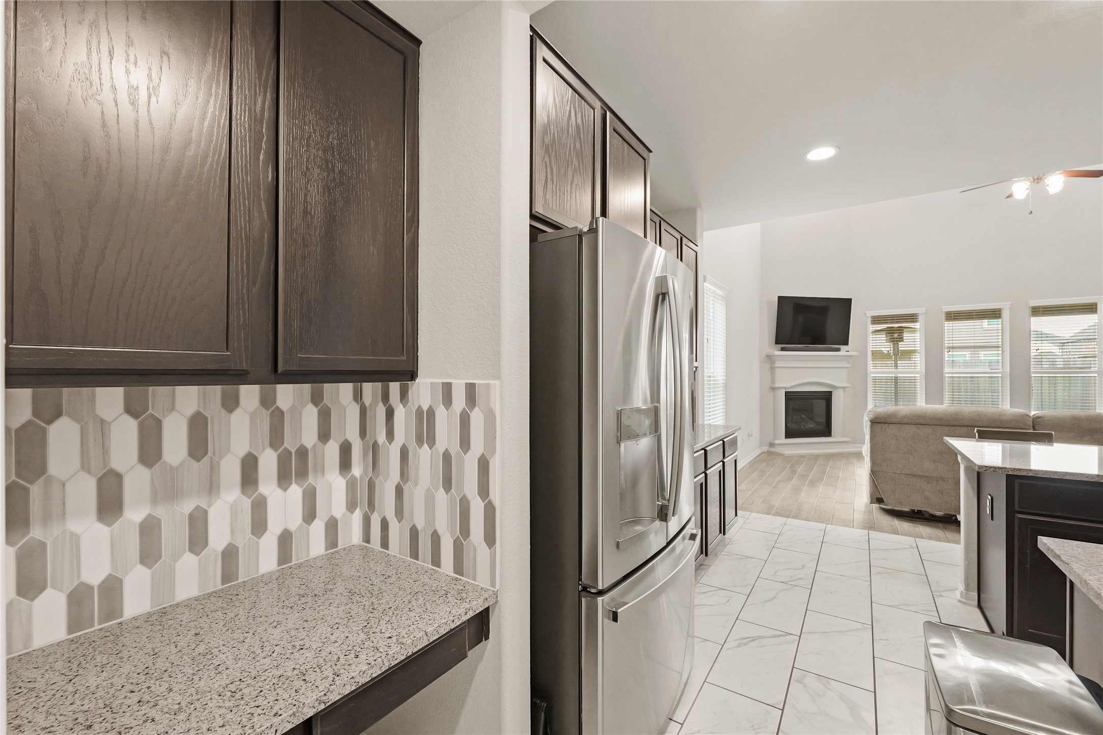 11107 Larkspur Dale Houston, TX 77044 - Photo 28 of 36 a view of kitchen with furniture and wooden floor