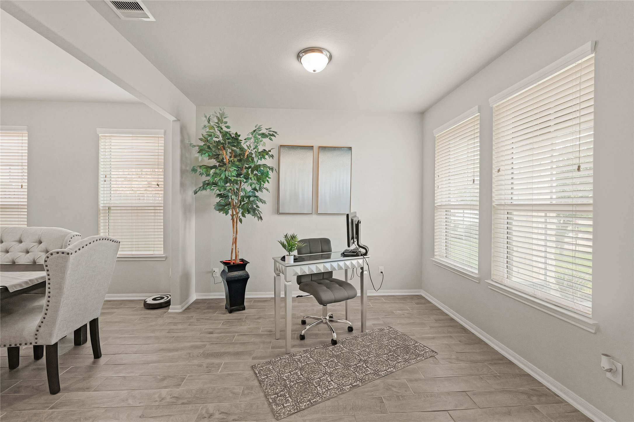 11107 Larkspur Dale Houston, TX 77044 - Photo 7 of 36 a living room with furniture a window and a potted plant