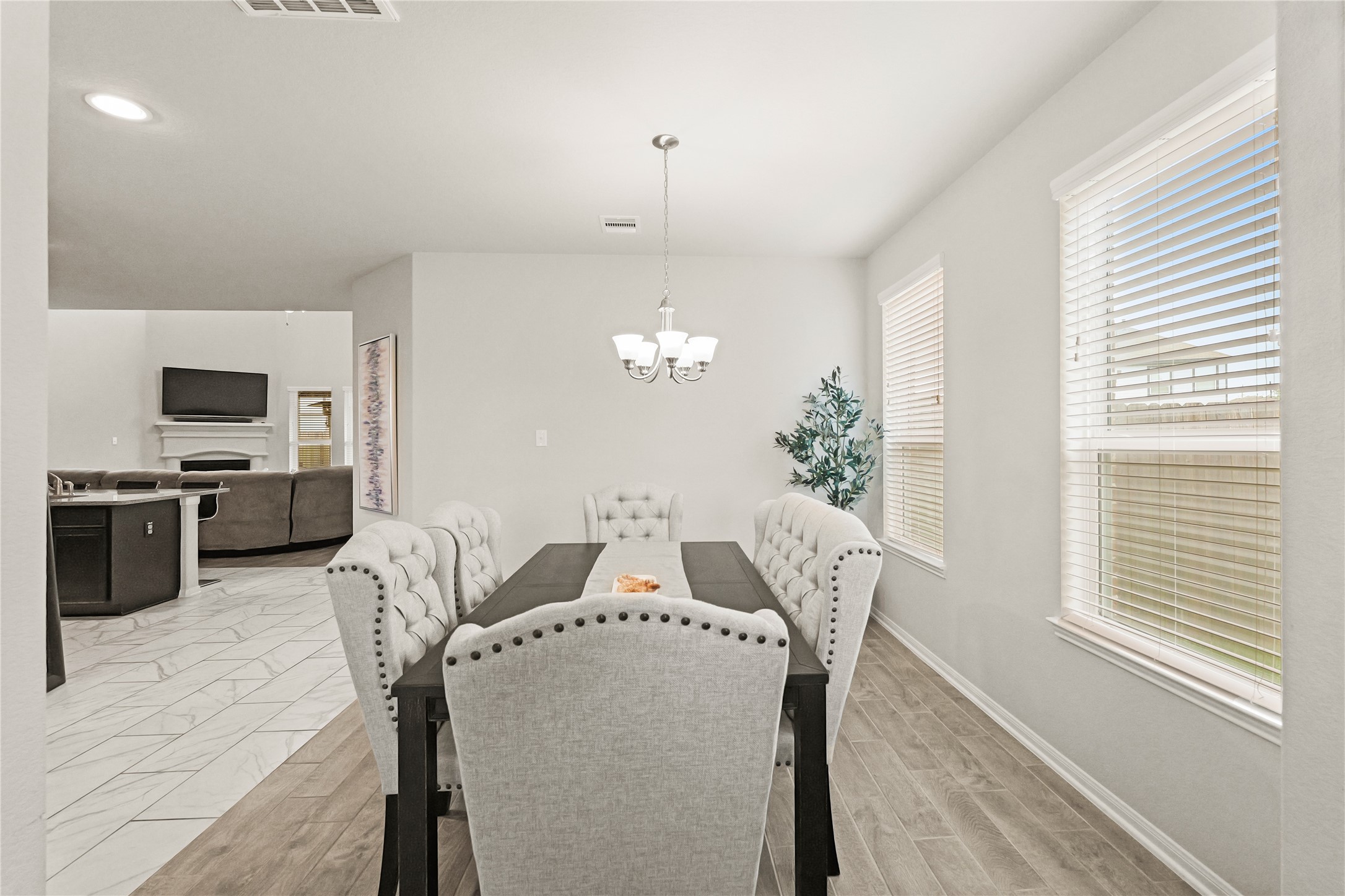 11107 Larkspur Dale Houston, TX 77044 - Photo 10 of 36 a view of a dining room with furniture and chandelier