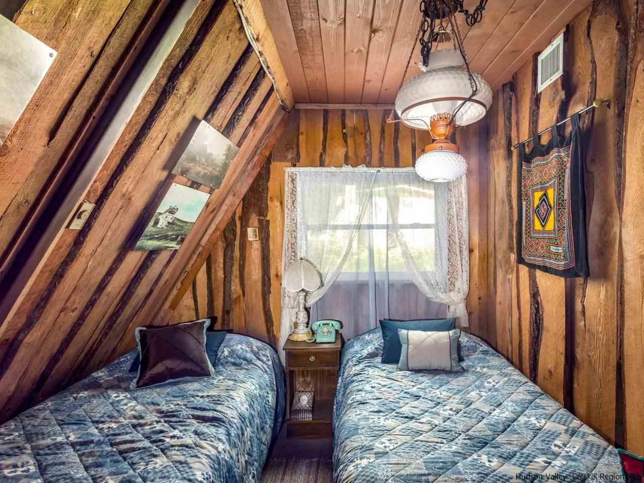 161 Pine Hill Road Shandaken, NY 12410 - Photo 13 of 19 a bedroom with furniture and a window