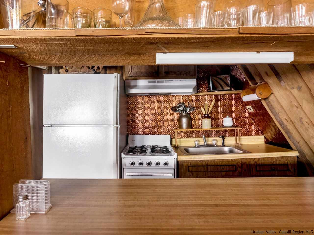 161 Pine Hill Road Shandaken, NY 12410 - Photo 15 of 19 a view of a living room and kitchen with furniture