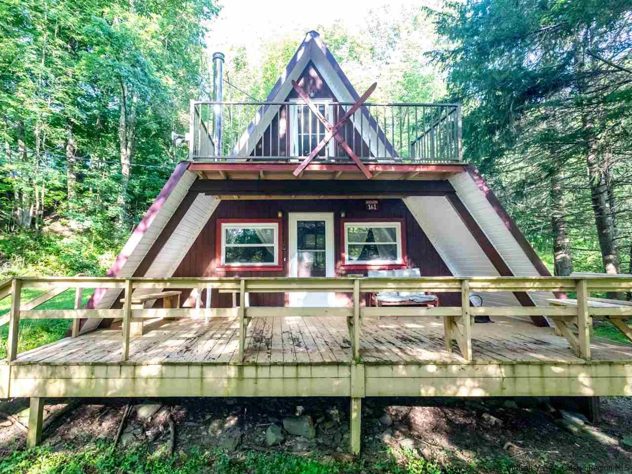 161 Pine Hill Road Shandaken, NY 12410 - Photo 2 of 19 a view of house with a big yard and large trees