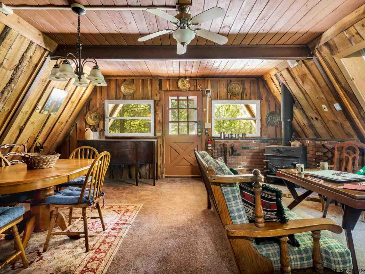 161 Pine Hill Road Shandaken, NY 12410 - Photo 3 of 19 a view of a dining room with furniture window and outside view