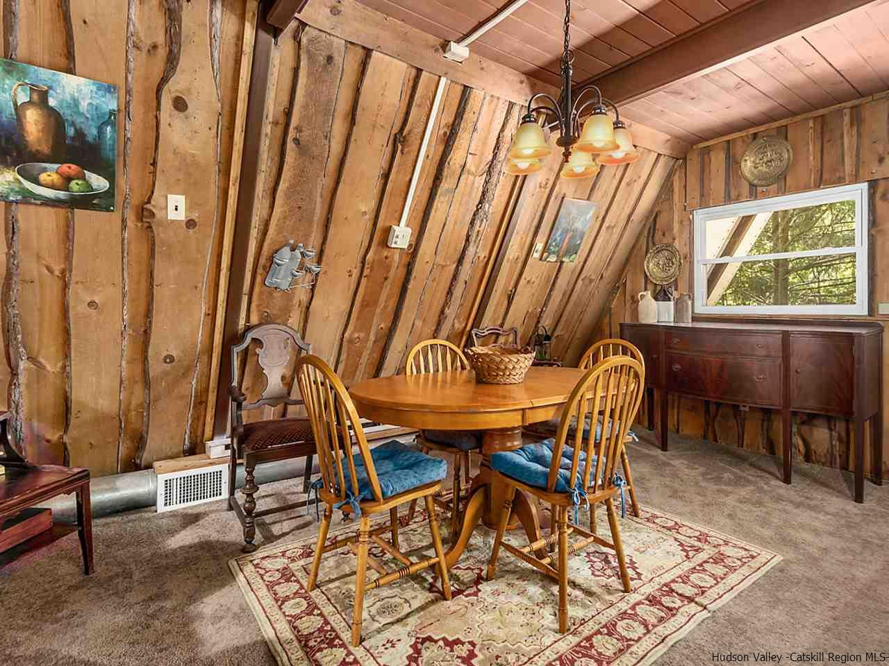 161 Pine Hill Road Shandaken, NY 12410 - Photo 7 of 19 a view of a dining room with furniture and chandelier