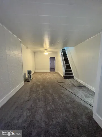 a view of an empty room with stairs