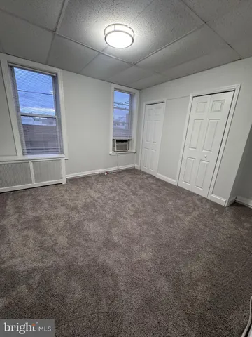 a view of an empty room and a window
